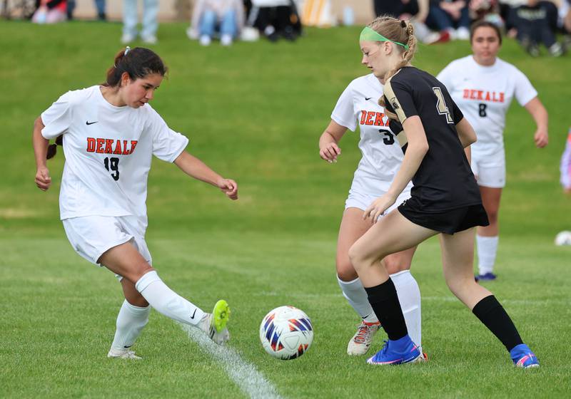 DeKalb's Cinthia Serrano Perez kicks the ball by Sycamore's Avery Olson Thursday, May 7, 2026, during their game at Sycamore High School.