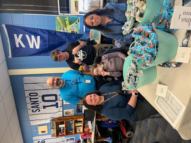 Dist. 308 Superintendent Andalib Khelghati, far left, and Dist. 308 staff and students at one of the Pathways Transition Center's craft show.