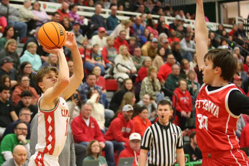 L-P's Braylin Bond shoots a jump shot over Ottawa's Seth Cooper on Friday, Feb. 7, 2025 in Sellett Gymnasium at L-P High School.