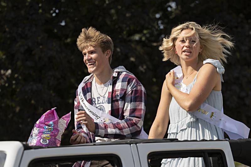 Newman King and Queen, Brendan Tunink and Ana Jungerman ride through the homecoming parade Friday, Sept. 29, 2023.