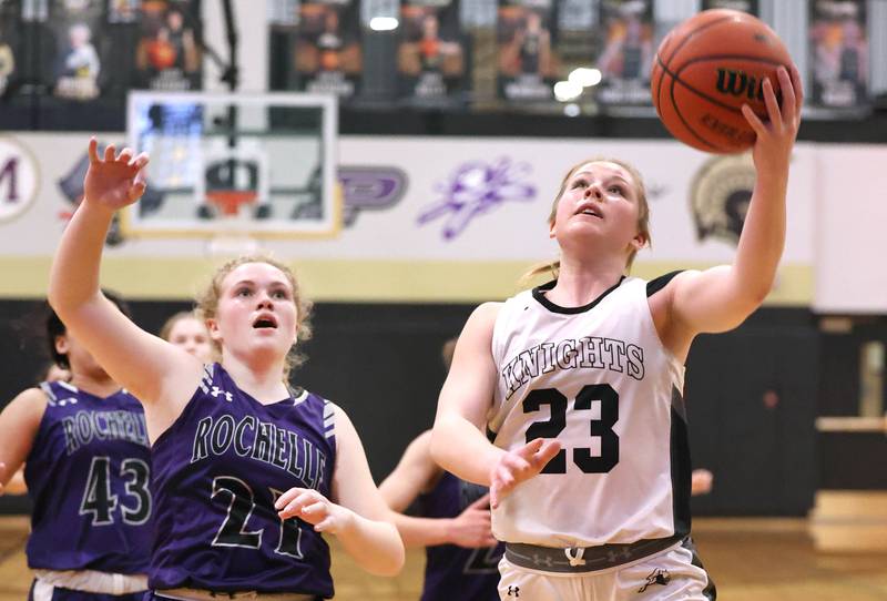 Kaneland's Kendra Brown gets to the basket ahead of Rochelle's Abby Metzger during their Class 3A regional semifinal game Tuesday, Feb. 14, 2023, at Sycamore High School.