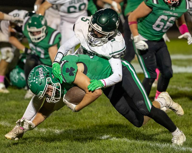 Cam Sriey (33) of Seneca is tackled by Chase Riva (5) of St. Bede after he attempts to run ball on Friday, Oct. 10, 2025 at Seneca High School in Seneca.