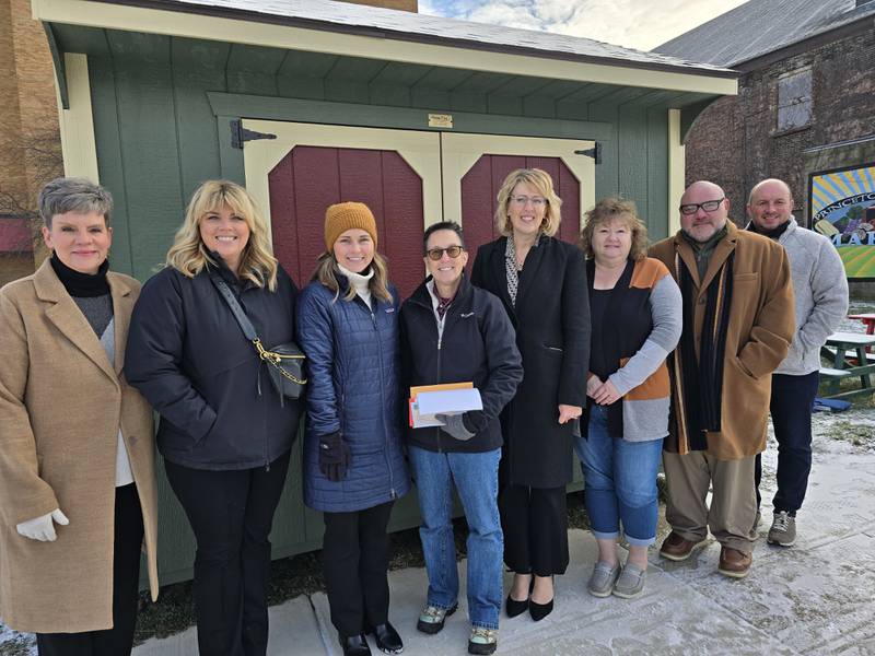 (From left) Sara Hudson of Heartland Bank; Victoria Yepsen, president of the Bureau County United Way Board of Directors; Beth Standley of Central Bank Illinois; Cori Cunningham, United Way executive director; Tracy Grimmer of First State Bank; Tracy Wright of Gateway Services; Nick Liebe of Midland States Bank; and Joe Kitchens of Midland Wealth Management, deliver donations on Giving Tuesday, Tuesday, Dec. 3, 2024, collected for the Bureau County United Way at their financial institutions.