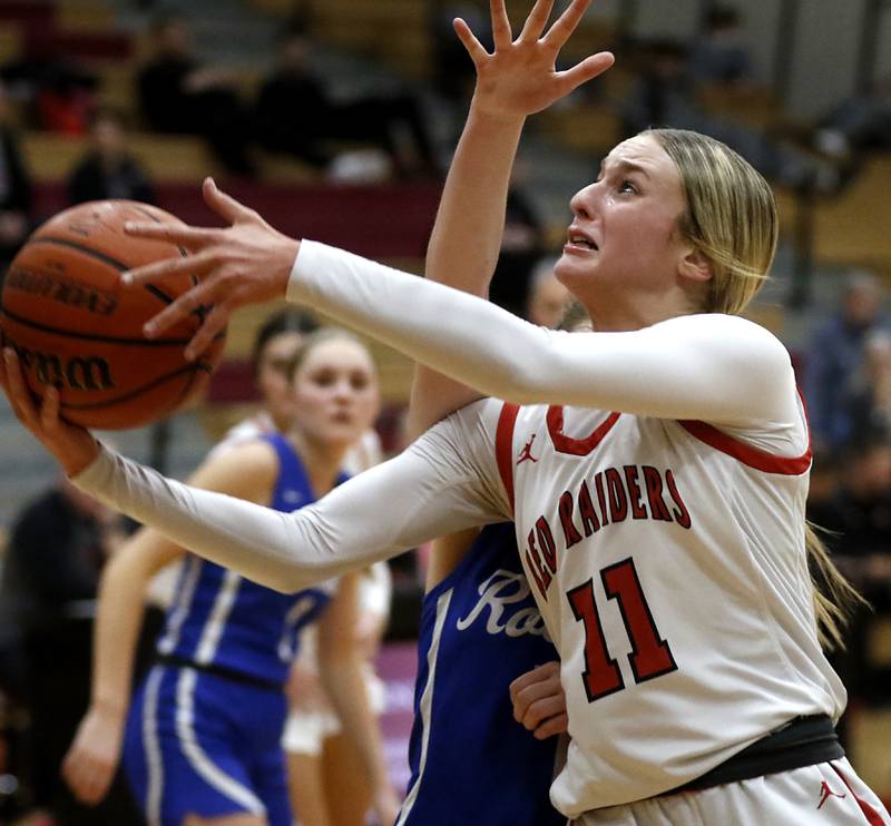 Huntley's Anna Campanelli is fouled by Burlington Central's Emersyn Fry as she drives to the basket during a Fox Valley Conference girls basketball game Friday, Feb.2, 2024, at Huntley High School.