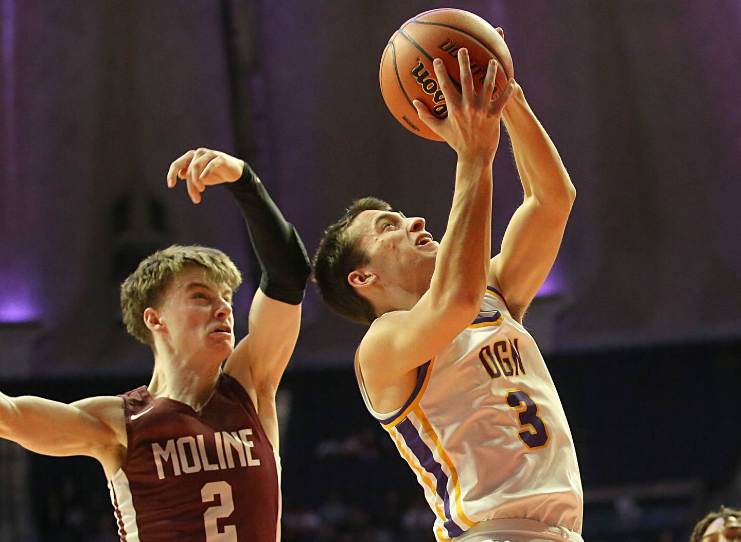Downers Grove North's Ethan Thuin runs in the lane in front of Moline's Brock Harding during the Class 4A state semifinal game on Friday, March 10, 2023 in Champaign.