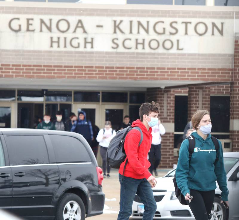 Genoa-Kingston High School students exit the building Tuesday after the first day back for in-person classes since the school was closed earlier this school year due to the COVID-19 pandemic. Genoa-Kingston High School resumed some in-person classes today as part of their hybrid learning plan which includes options of in-person and remote learning.