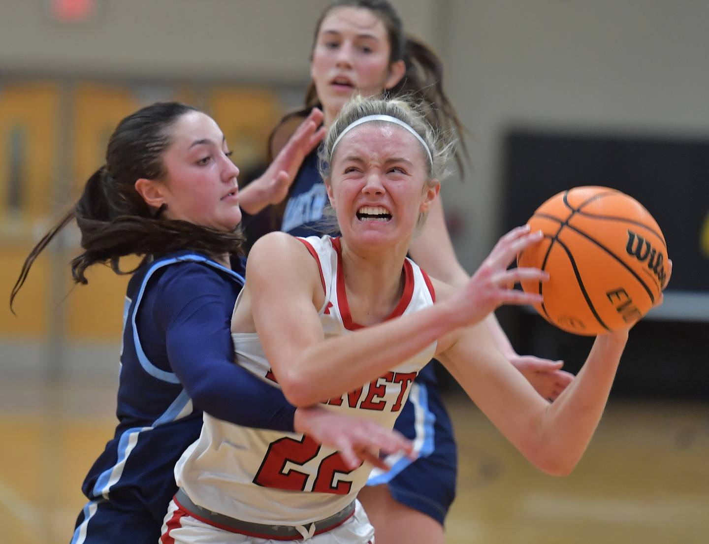 Benet’s Bridget Rifenburg goes to the basket as Nazareth’s Samantha Austin defends during a game on January 28, 2026 at Benet Academy in Lisle.