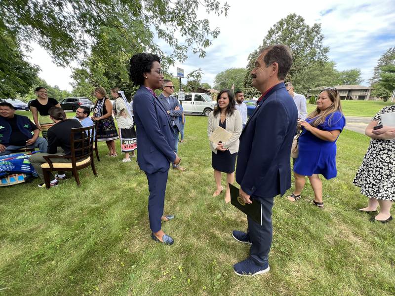 While in Shabbona on Aug. 11 2022, state Sen. Cristina Pacione-Zayas, D-Chicago smiles while talking to U.S. Rep. Lauren Underwood, Democrat of Naperville and U.S. Rep. Jesus “Chuy” Garcia, Democrat of Chicago.