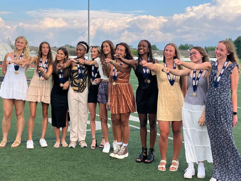 Huntley's Class 3A girls track and field state champions, showing off their state title rings: (from left) Ally Panzloff,  Breanna Burak, Vicky Evtimov, Dominique Johnson, K'Leigh Saenz, Brittney Burak, Sophie Amin, Alex Johnson, Sienna Robertson, Abbie Williams and Addison Busam.
