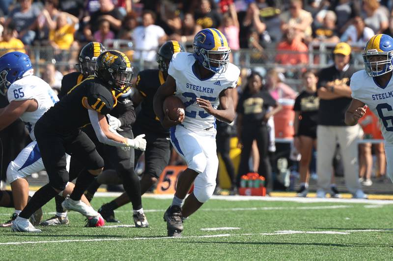 Joliet Central’s Jaylin Murphy breaks through the front line on a run against Joliet West on Saturday, Sept. 23, 2023 in Joliet.