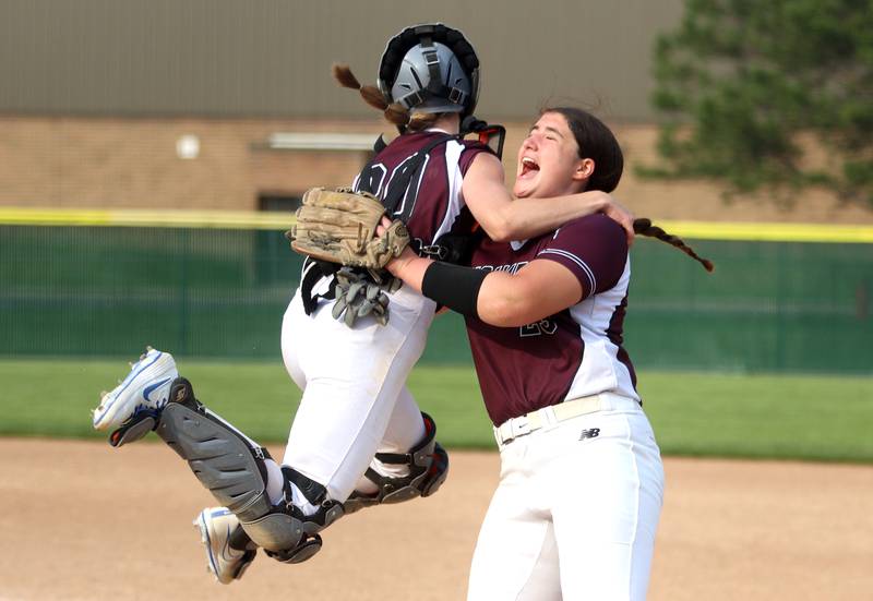 Prairie Ridge’s Reese Mosolino, right, and Kendra Carroll celebrate the final out of a 1-0 win over Crystal Lake Central in Class 3A Regional softball action at Crystal Lake South Wednesday.