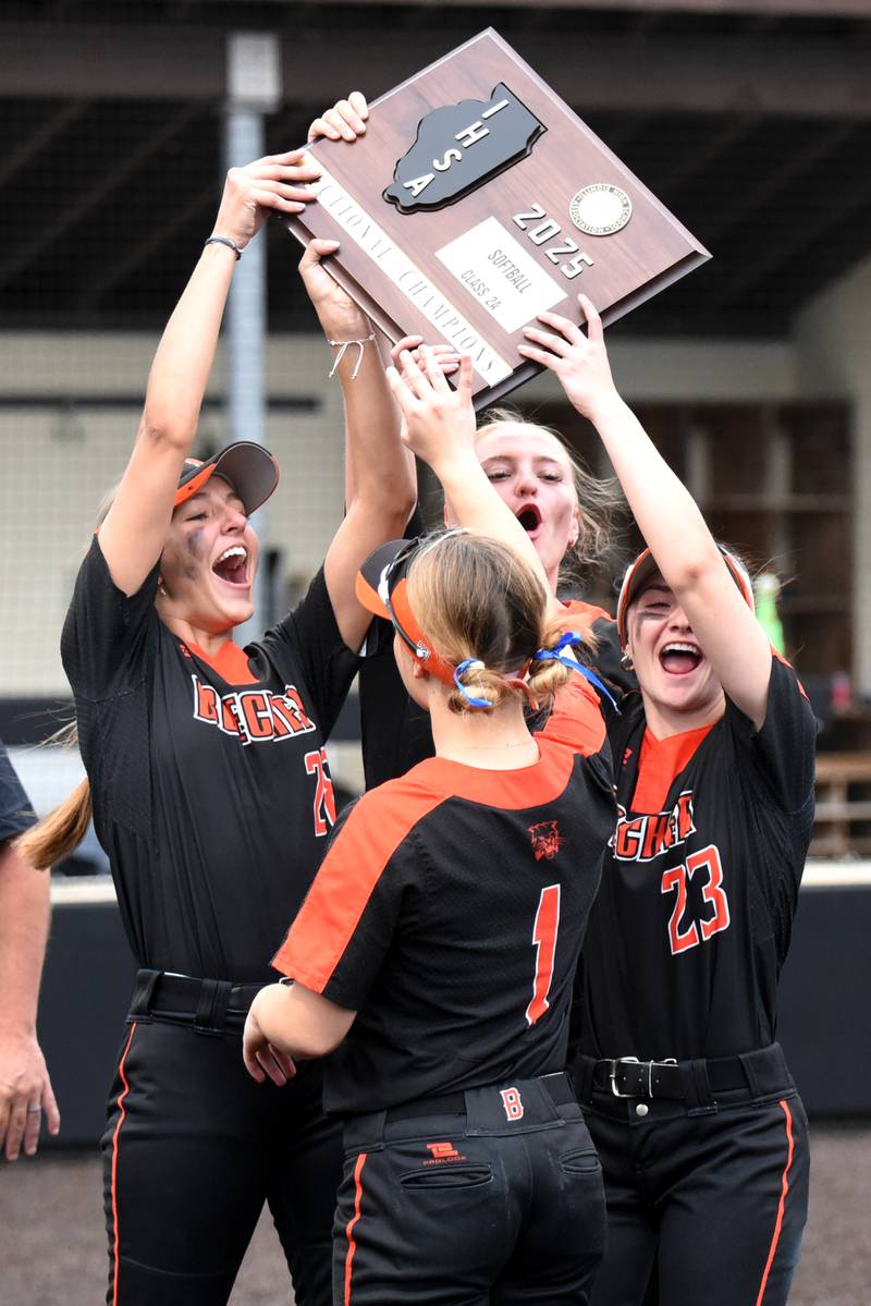 Beecher senior softball captains, clockwise from left, Ava Olson, Abrianne Papas, Tayiah Scanlan and Alexa Gliva hoist the Class 2A Seneca Sectional championship plaque after defeating Seneca 1-0 in the championship game Friday, May 30, 2025.