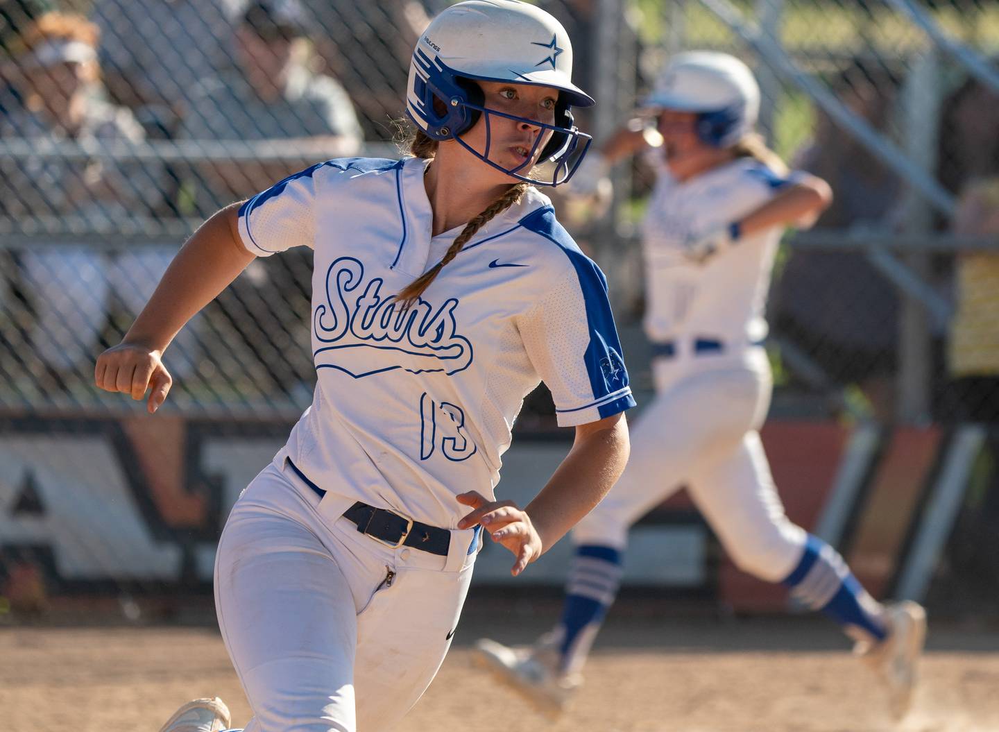 St. Charles North's Margo Geary (13) hits a triple scoring three runs against Glenbard North during the St. Charles East 4A sectional championship at St.Charles East High School on Friday, Jun 3, 2022.