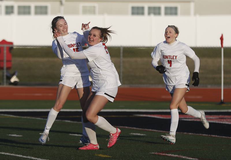 Huntley's Bella Fusco (left) celebrates her teammate, Peyton Kohn, after Kohn scored the game tying goal during a nonconference soccer game against Boylan Catholic on Wednesday, March 27, 2024, at Huntley High School.