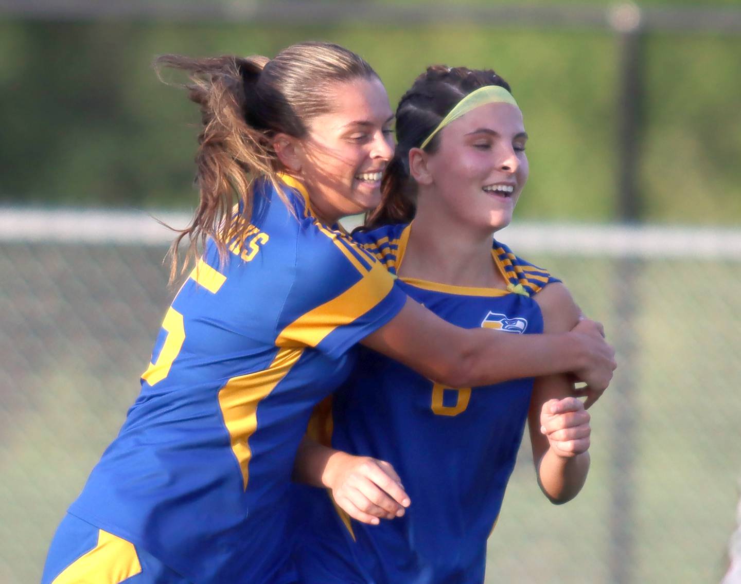 Johnsburg’s Liz Smith, right, is embraced by Lauren McQuiston after Smith scored the Skyhawk’s fourth goal of the game against North Shore Country Day in IHSA Class 1A Sectional Title Game action at Richmond-Burton High School in Richmond on Tuesday, May 27, 2025.