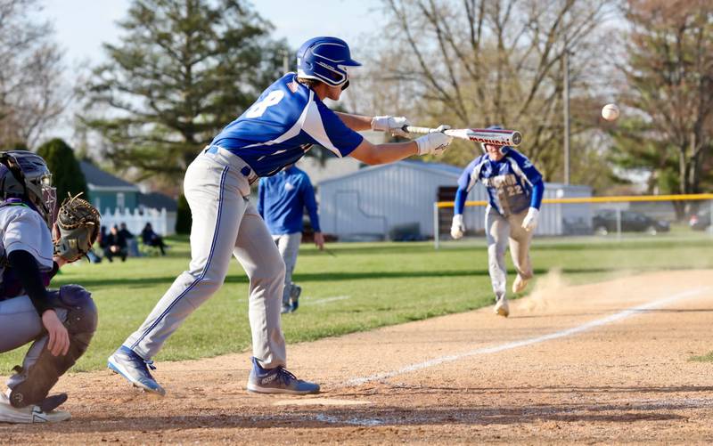 Princeton's Ryan Jagers pops up a squeeze bunt with Jordan Reinhardt coming home in the fifth inning of Monday's game which turned into a double play.  The Tigers beat Mendota 6-2.