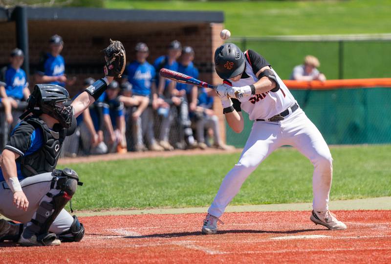 St. Charles East's Carter Laskowski (7) is hit by a pitch during a baseball game against St. Charles North at St. Charles East High School on Saturday, May 7, 2022.