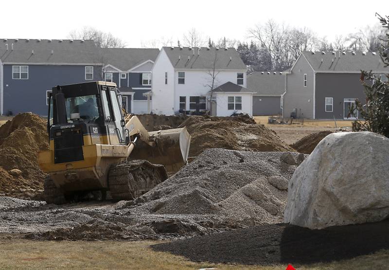 Construction continues on the installing water and sewer lines in the Stonewater subdivision in Wonder Lake on Friday, Feb. 24, 2023. When the subdivision is finished, 3,400 to 3,700 more rooftops will be added to Wonder Lake, potentially making the village one of the larger municipalities in McHenry County.