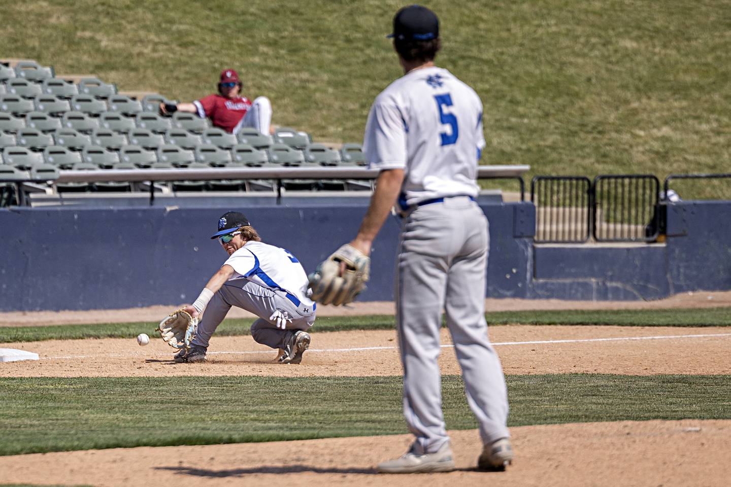 Newman’s Garet Wolfe backhands a ball at third against Goreville Saturday, June 3, 2023 during the IHSA class 1A third place baseball game.