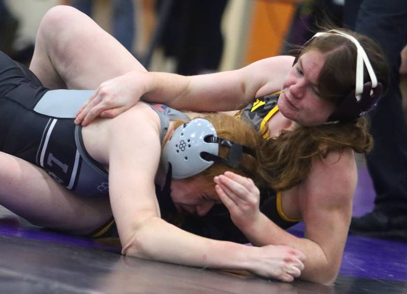 Richmond-Burton’s Brooklyn Peterie, right, battles  New Lenox’s Liz Clumpner at 135 pounds in Whip-Pur Women’s Classic varsity girls wrestling on Saturday, Dec. 20, 2025, at Hampshire High School in Hampshire.