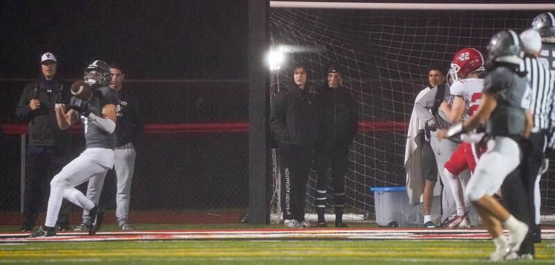 Oswego East's Aidan Wright (7) catches a pass for a touchdown against Yorkville late in the first quarter of play during a football game at Yorkville High School on Friday, Oct. 13, 2023.