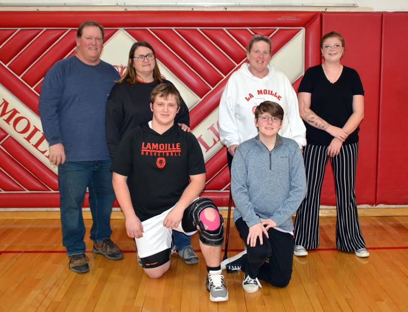 LaMoille senior Ian Sundberg and senior manager Donna Sloan and their parents were recognized on Senior Night on Friday night