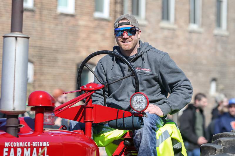 The Lemont tractor club ride on antique tractors in the Lemont St. Pat's Day Parade on Saturday, March 8, 2025  in Lemont