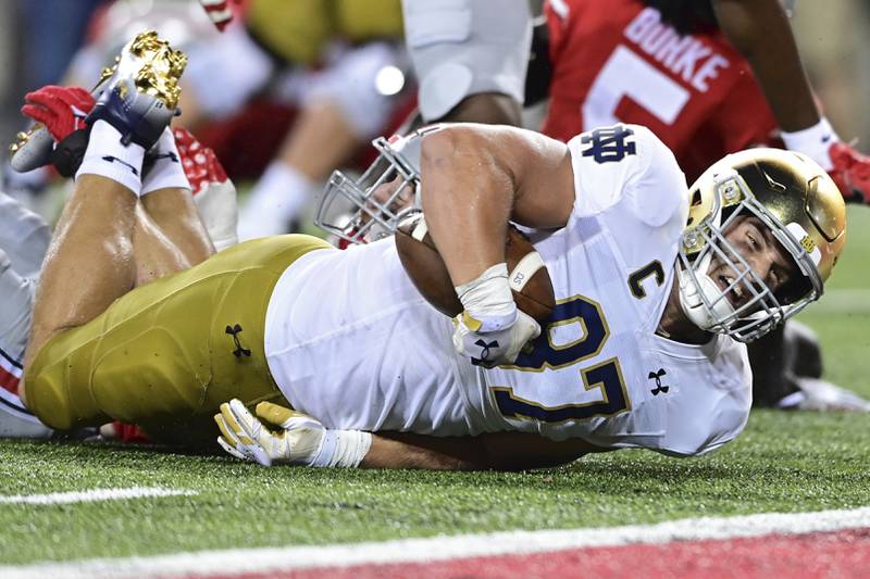 Notre Dame tight end Michael Mayer is tackled during the second quarter of an NCAA college football game against Ohio State, Saturday, Sept. 3, 2022, in Columbus, Ohio. (AP Photo/David Dermer)