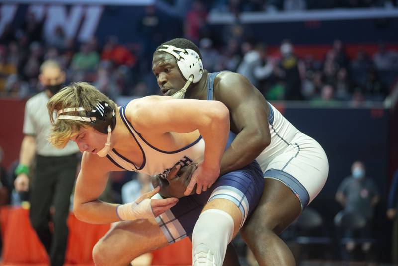 IC Catholic's Jadon Mims controls Nazareth's Gabe Kaminski during the 1A 220lb finals match at the IHSA state wrestling meet on Saturday, Feb. 19, 2022.