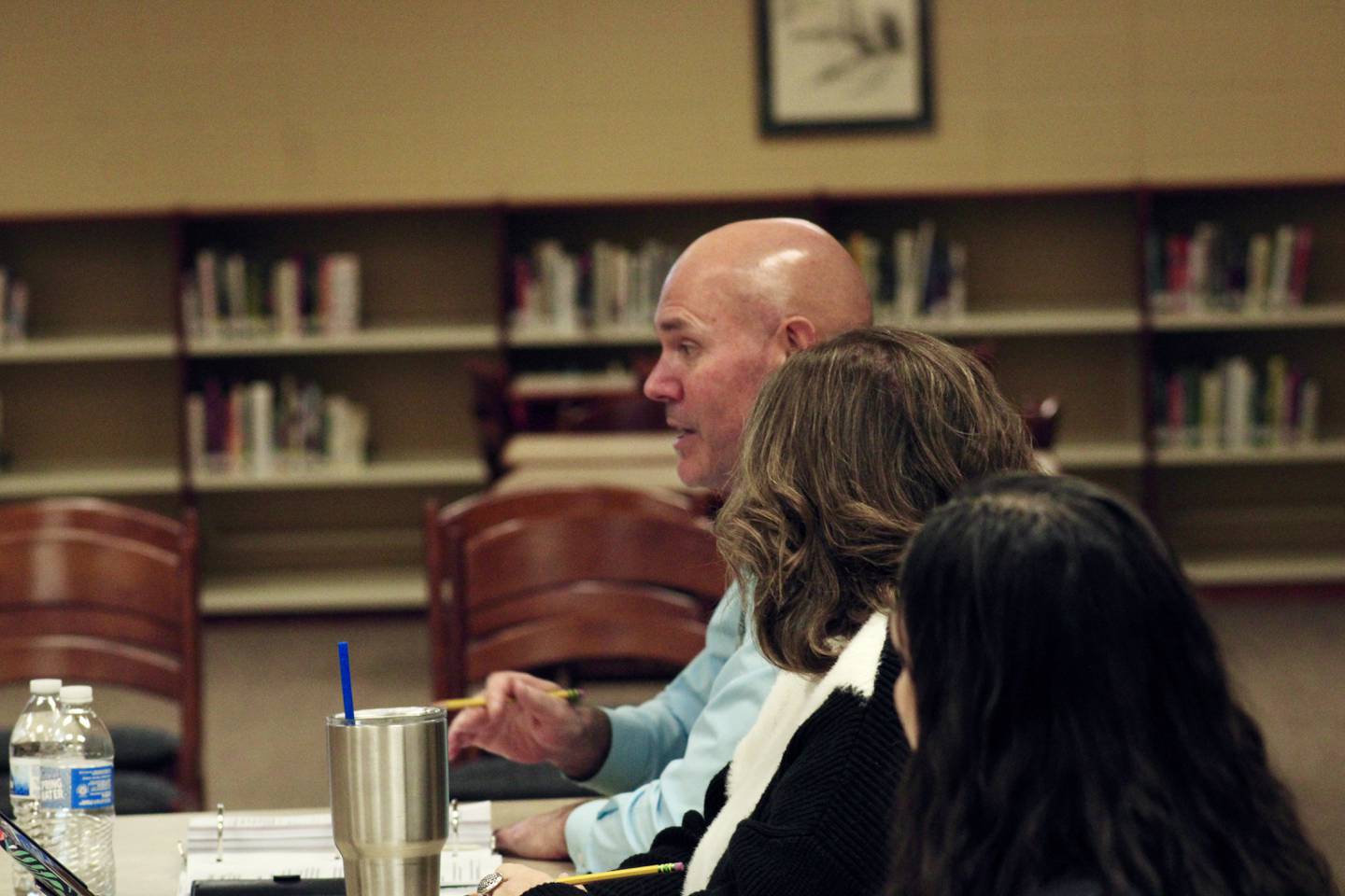 Tad Everett, superintendent at Sterling Public Schools, describes the decline in new teachers as a prelude to a description of SPS University on Wednesday, Jan. 25, 2023. Listening are board of education President Pam Capes and administrative assistant Julie Arreola.