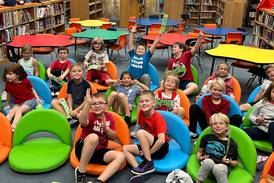 Rotary Club of Sandwich helps provide comfy seating in Sandwich school’s library