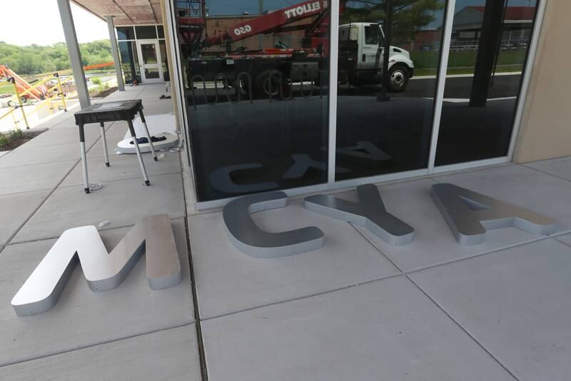 Giant letters spelling Ottawa YMCA are waiting to be installed on the front of the building at the new YMCA on Monday, May 6, 2024 in Ottawa.