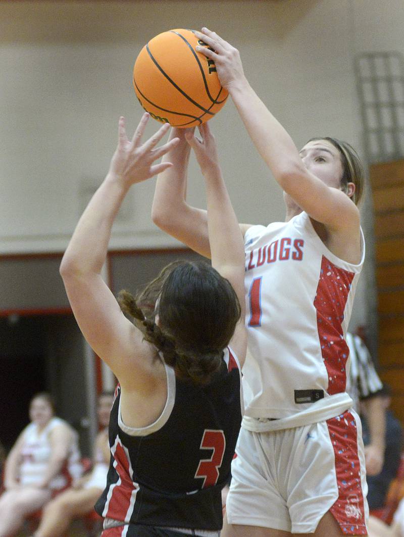 Streator’s Rhea Huey releases a shot over the block attempt of  Henry-Senachwine’s Lauren Harbinson in the 2nd period Tuesday at Streator.