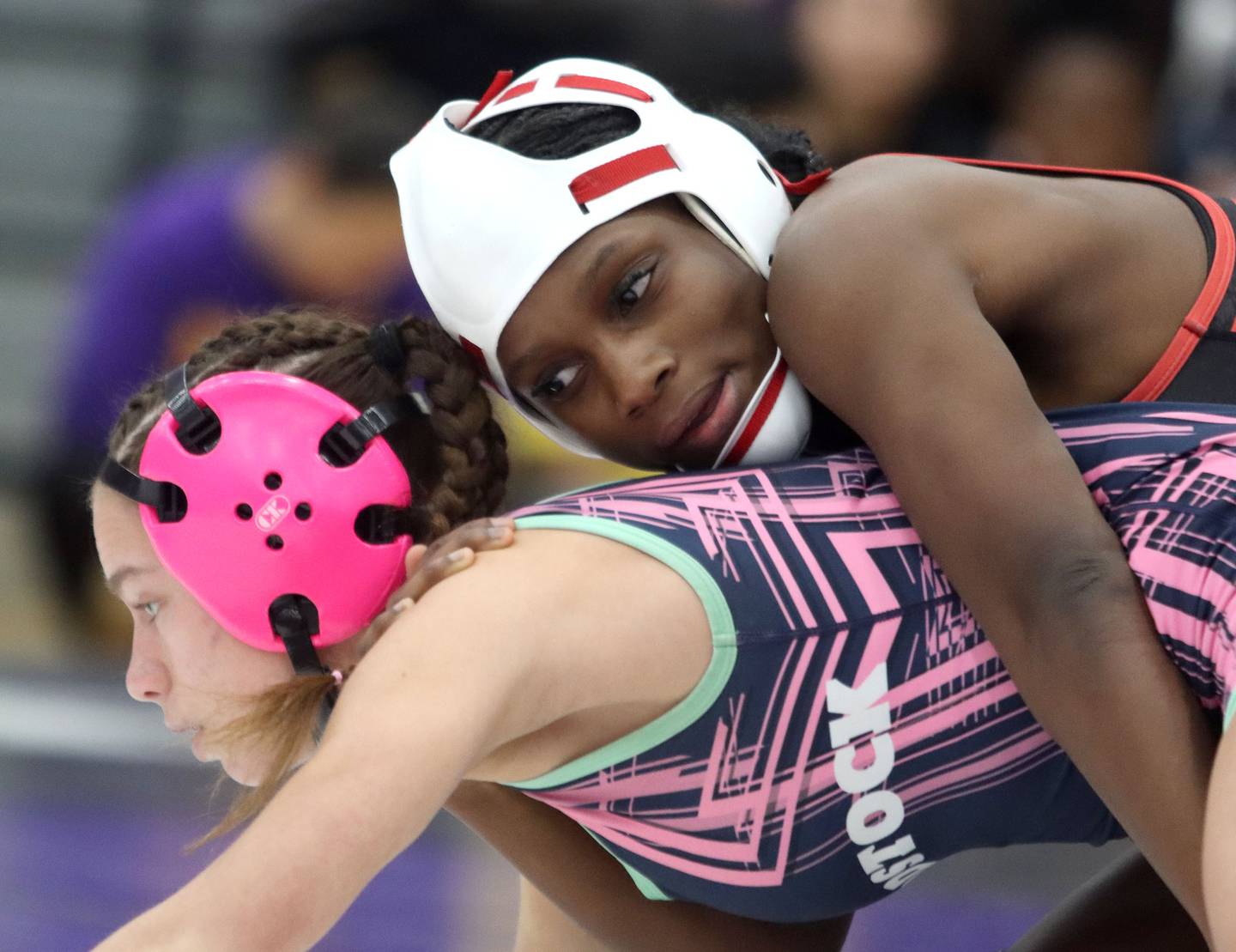 Huntley’s Janiah Slaughter, top, battles Woodstock’s Eva Hermansson at 100 pounds in varsity girls IHSA Regional Championship wrestling action on Saturday, February 7, 2026, at Hampshire High School in Hampshire.