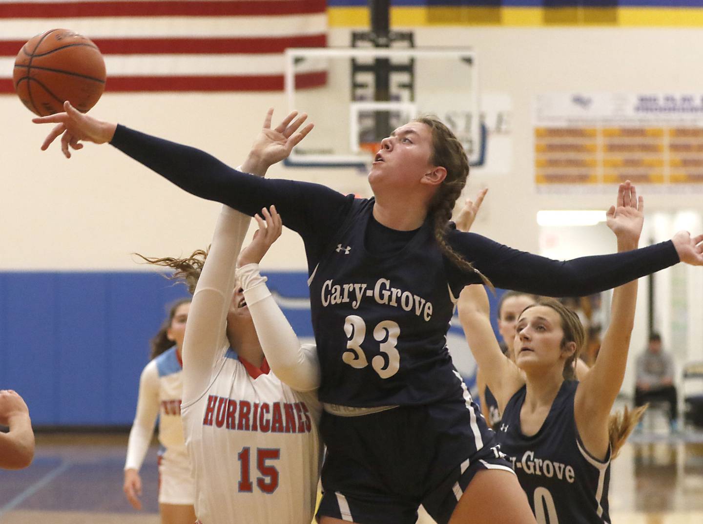 Cary-Grove's Ellie Mjaanes blocks the shot of Marian Central's Michaela Johnson on Thursday, Nov. 16, 2023, during a Johnsburg Thanksgiving Tournament girls basketball game at Johnsburg High School.