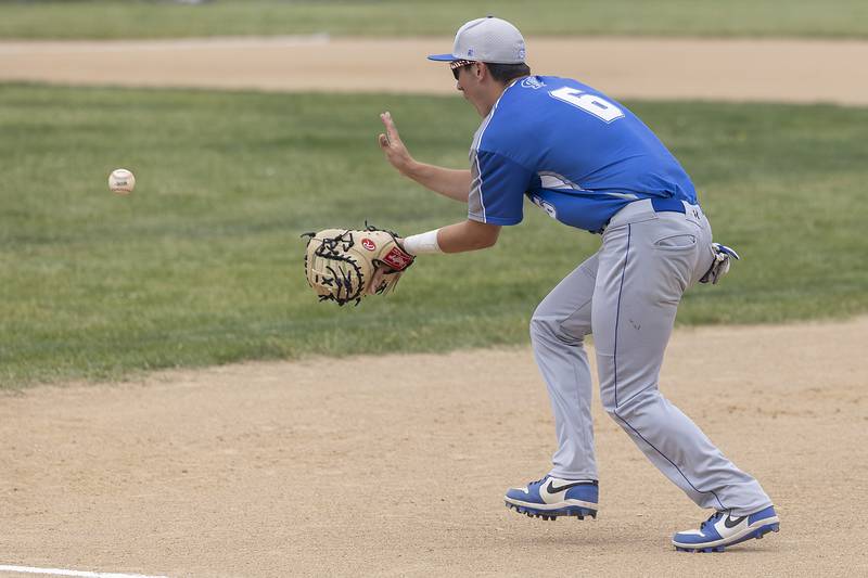Newman’s Evan Bushman fields a ball at first for an out against Johnsburg Saturday, May 31, 2025, in the Class 2A Sectional final in Mendota.