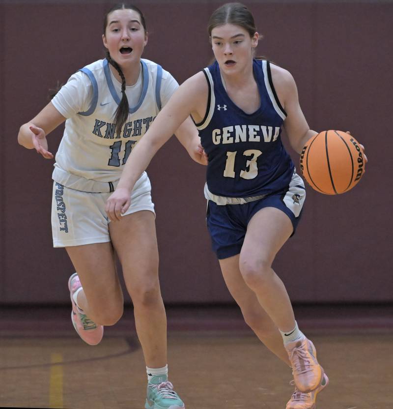 Prospect’s Maeve Johl yells as Geneva’s Linnea Popp gets past her in a girls basketball game at Montini Catholic High School in Lombard Monday.