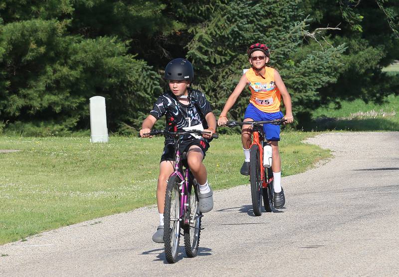 AJ Anderson and Michael Jones both of Princeton, ride along County Road 1300 North during the Z Tour event on Saturday June 21, 2025 in Princeton.