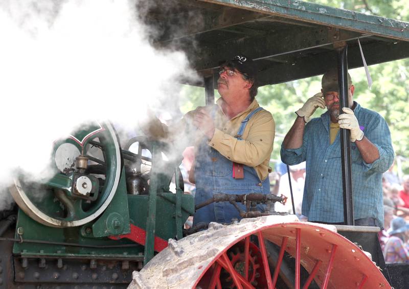 Steam pours from one of the tractors Thursday, Aug. 8, 2024, during the 67th annual Sycamore Steam Show and Threshing Bee at Taylor Marshall Farm.
