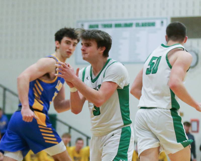 York's Connor Fitzgerald (3) reacts after after making a three during their basketball game between Lyons at York. Jan 10, 2025 in Elmhurst.