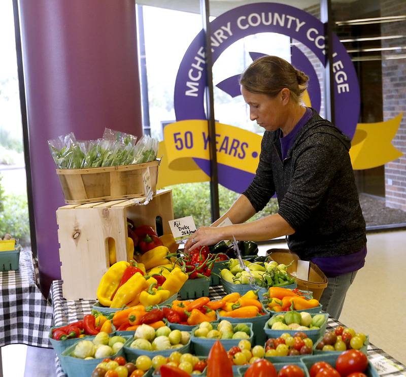 Emily Zack, a McHenry County College student farm manager, prices food at McHenry County College, 8900 Route 14 in Crystal Lake, on Monday, Sept. 12, 2022. Produce from the student farm is available to students on Mondays. Monday was the start of 12-week courses, at the campus. The regular semester started several weeks ago.