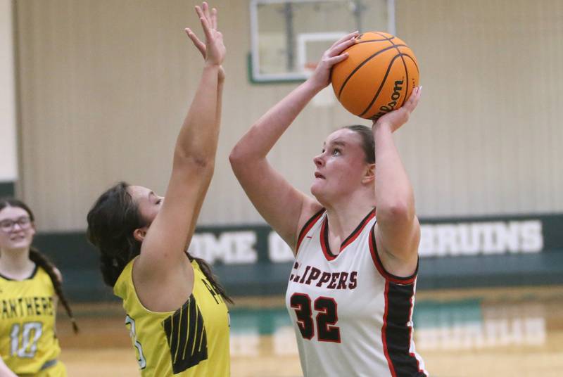Amboy/Ohio's Emily Sachs eyes the hoop as Putnam County's Valeria Villagomez defends during the Class 1A Regional semifinal game on Tuesday, Feb. 18, 2025 at St. Bede Academy.