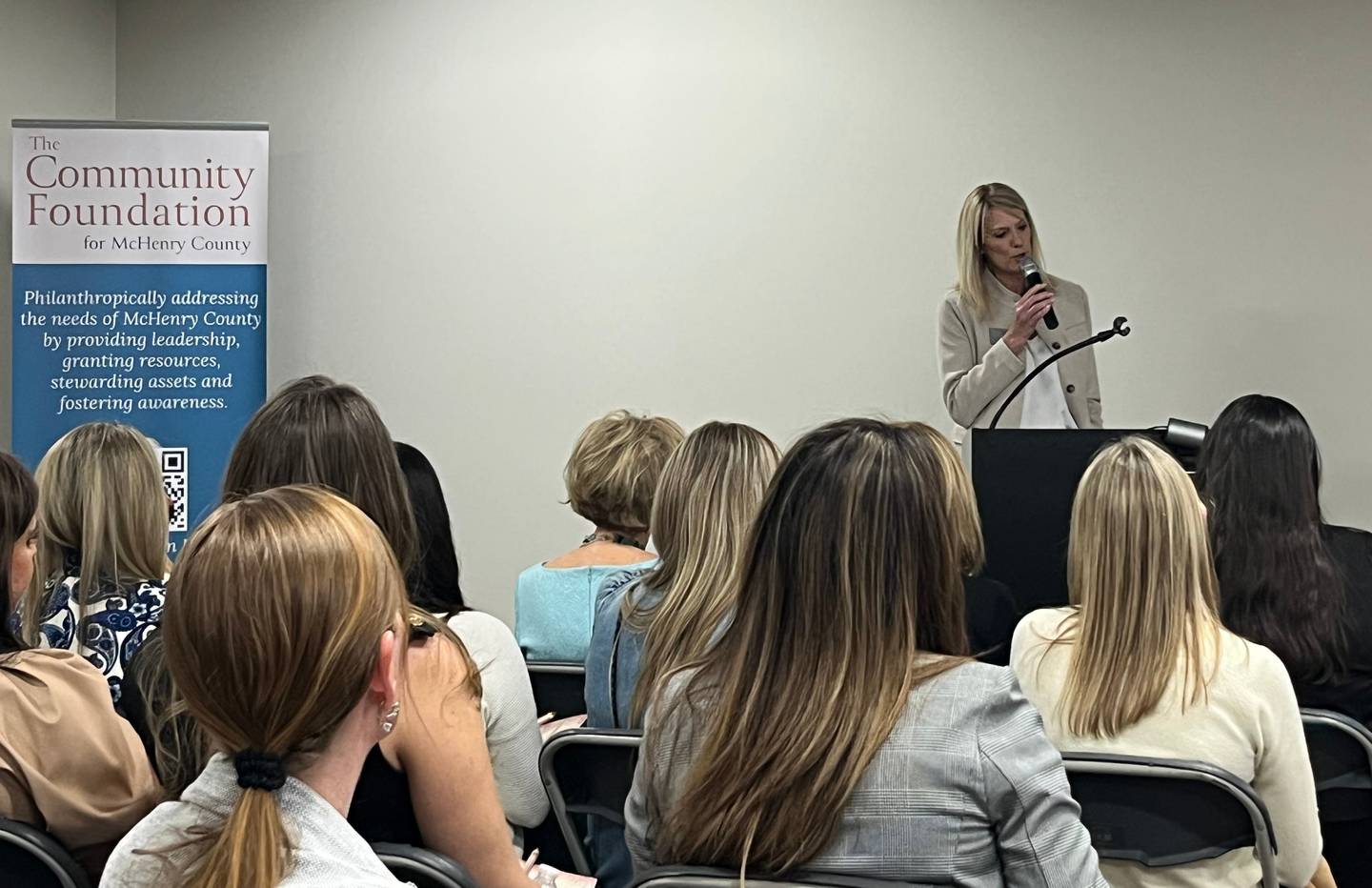 The Community Foundation for McHenry County Executive Director Amy Hernon speaks on March 13, 2025, at the Women in Philanthropy event, at which a new women's fund was announced.