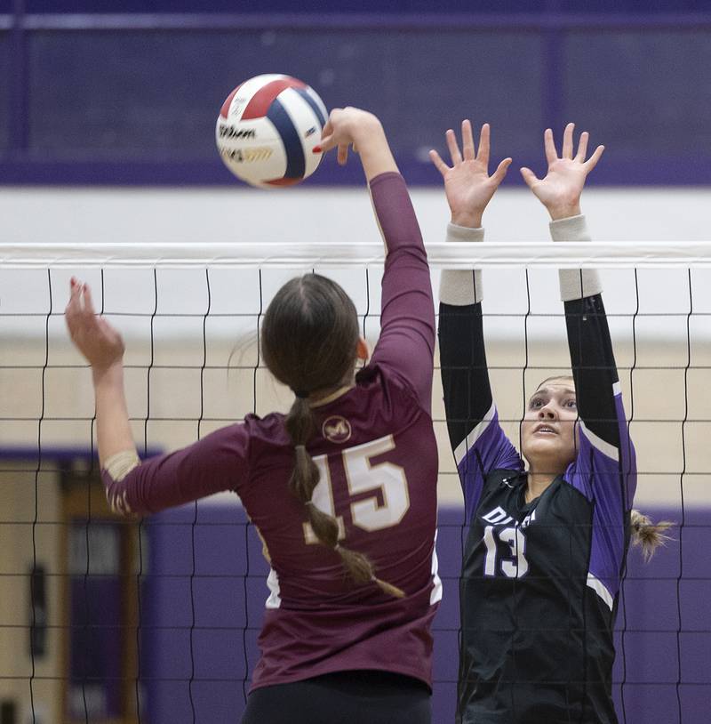Morris’ Lily Hansen flips the ball against Dixon’s Solis Thompson Thursday, Oct. 31, 2024 in the class 3A regional championship at Dixon High School.