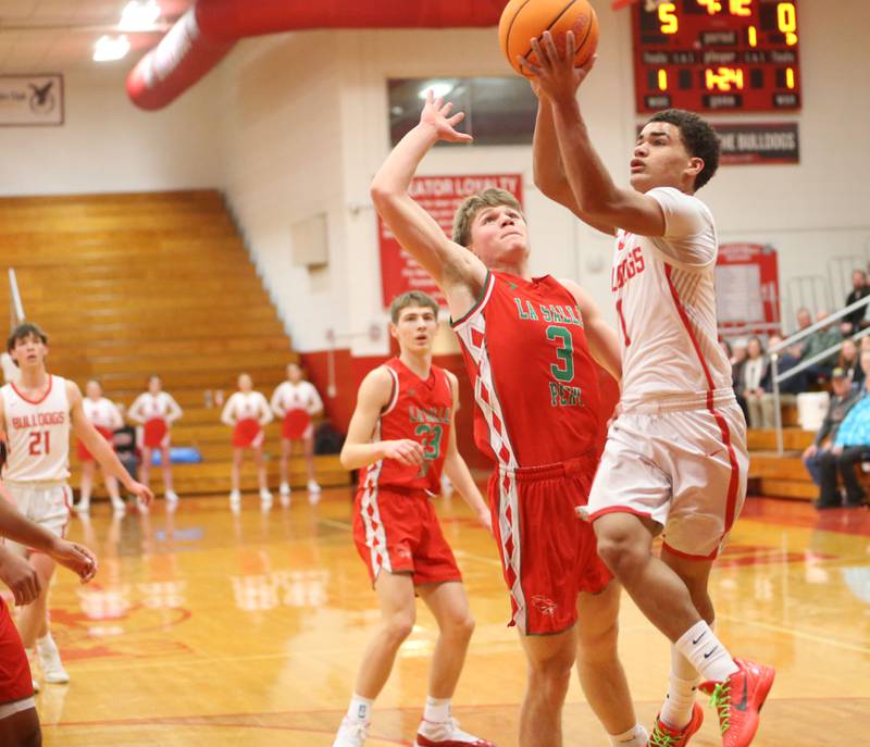 Streator's Layzeric Moton eyes the hoop as L-P's Braylin Bond defends on Tuesday, Jan. 13, 2026 in Pops Dale Gymnasium at Streator High School.