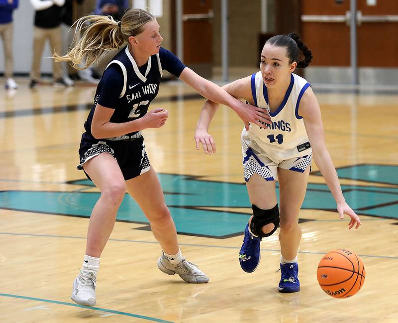 Geneva's Heidi Clesen (right) brings the ball up the court against St. Viator's Emily Walberg during the IHSA Class 3A Woodstock North Supersectional girls basketball game on Monday, March 2, 2026, at Woodstock North High School.