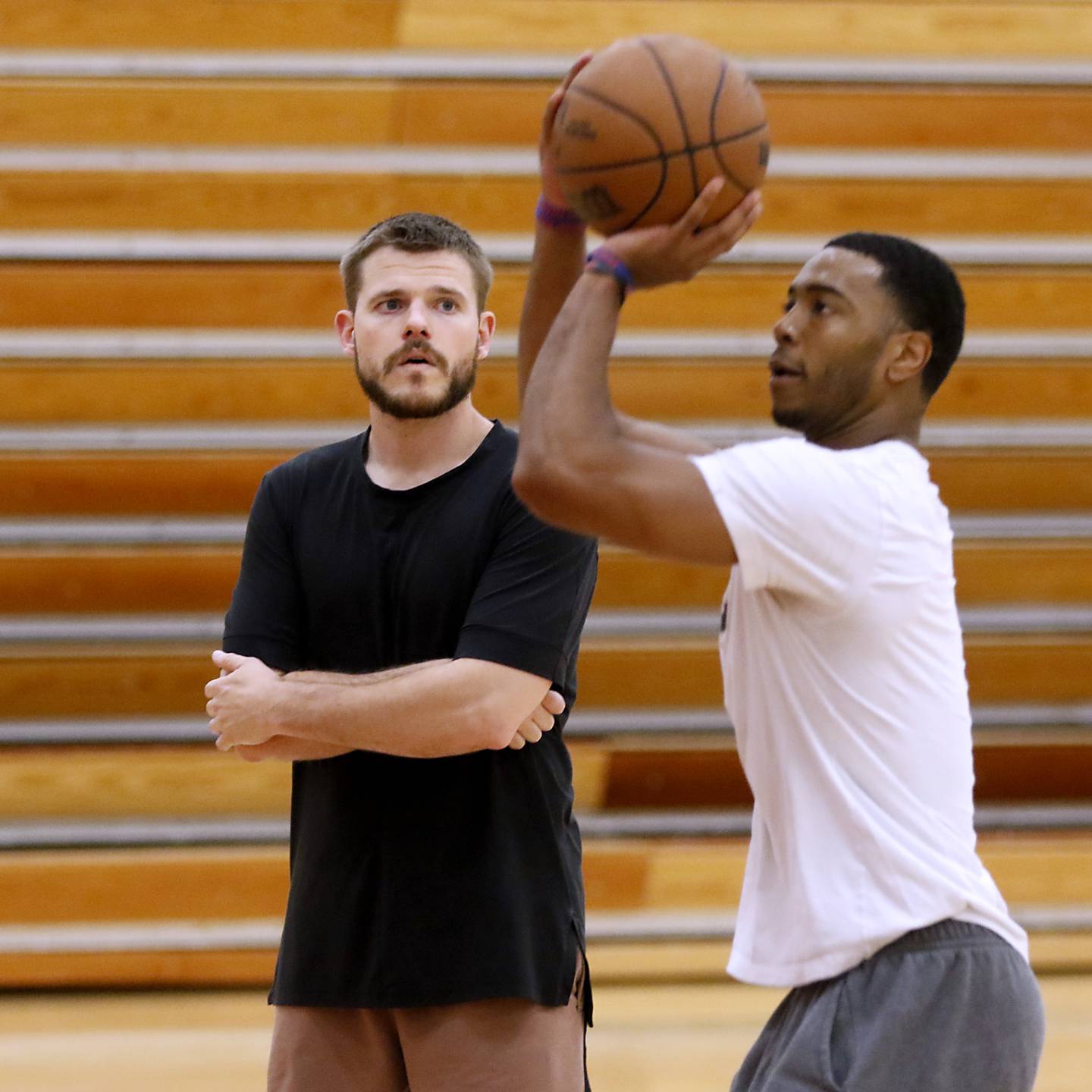 Zac Boster, the assistant men's basketball coach at Triton College in Triton College
River Grove, and a Huntley graduate, watches Shaq Harrison’s shot as he works with him on his basketball skills Thursday morning, Sept. 29, 2022. Boster has made a name for himself in the basketball world, teaching skills to high-level college and pro players.