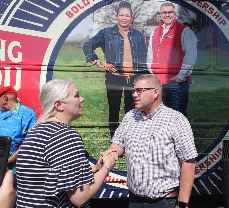 Darren Bailey, a Republican candidate for Illinois governor, greets supporters Friday, June 17, 2022, during his campaign stop at Tom and Jerry's in Sycamore. Bailey is currently on a bus tour across the state that will cover 102 countys in 14 days.
