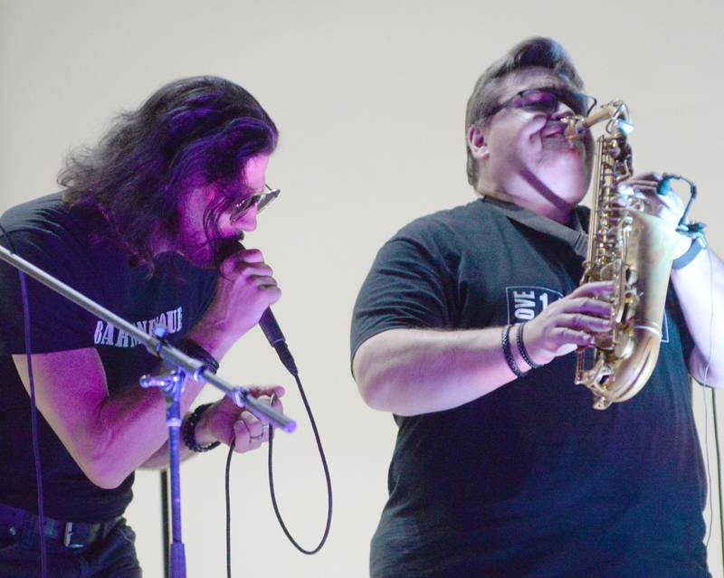 Jeff Anthony sings as John Carlson plays the saxophone with Brass From The Past at the Jamboree Concert Series on Friday, Aug. 1, 2025 in Mt. Morris.