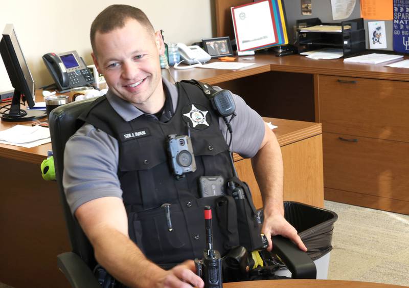 Chris Sullivan, DeKalb Police officer and student resource officer at DeKalb High School, talks Thursday, Oct. 20, 2022, at the school, about what he enjoys most about working with students and some of the challenges that it can create.